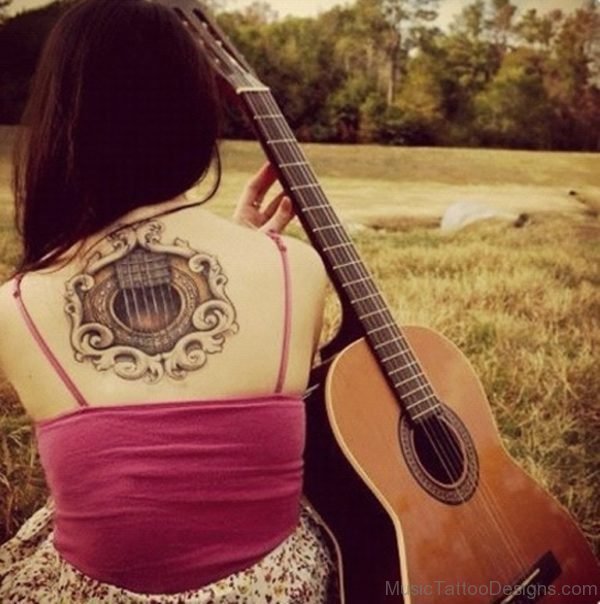 Guitar Tattoo On Girl Back