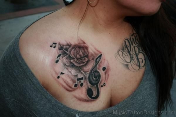 Amazing Music And Rose Tattoos On Chest