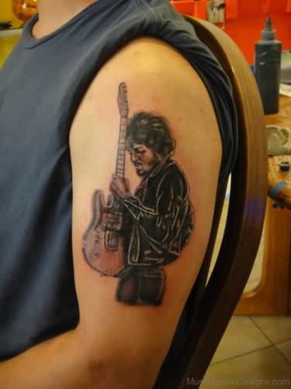 Band Man Hold Guitar Tattoo On Shoulder