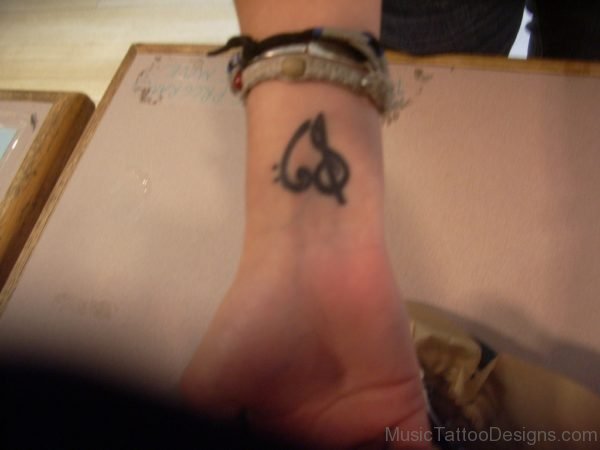 Black Ink Heart Tattoo On Wrist