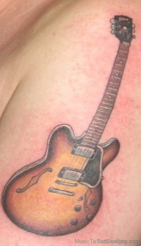 Brown Guitar Tattoo On Shoulder