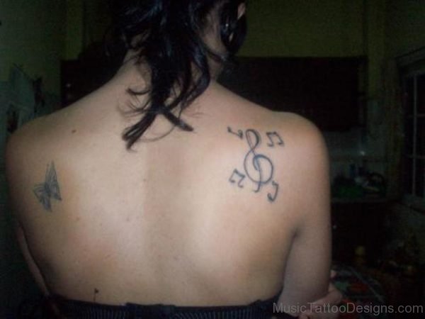 Butterfly With Music Notes Tattoo On Back Body