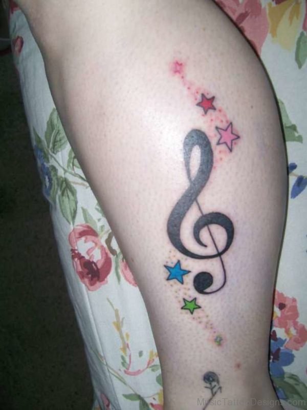 Colored Star And Music Tattoo On Leg