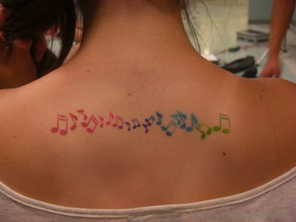 Colorful Airbrush Music Notes Tattoo On Upperback