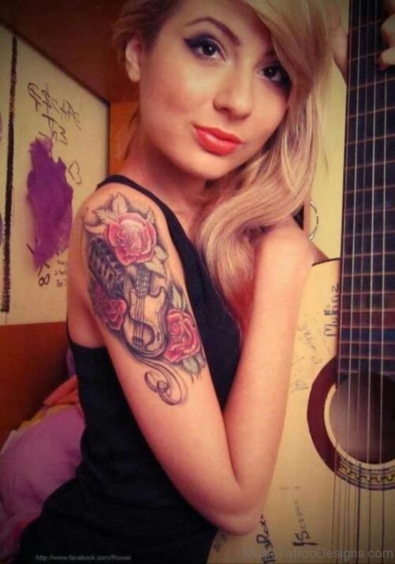 Girl With Roses And Guitar Tattoo On Right Shoulder