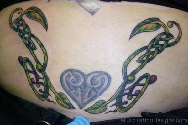 Heart And Music Note Tattoo On Lower Back
