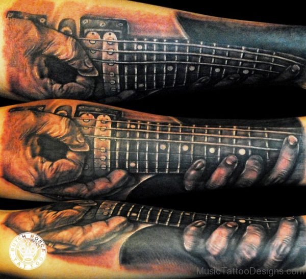 Marvelous Guitar Tattoo On Forearm 