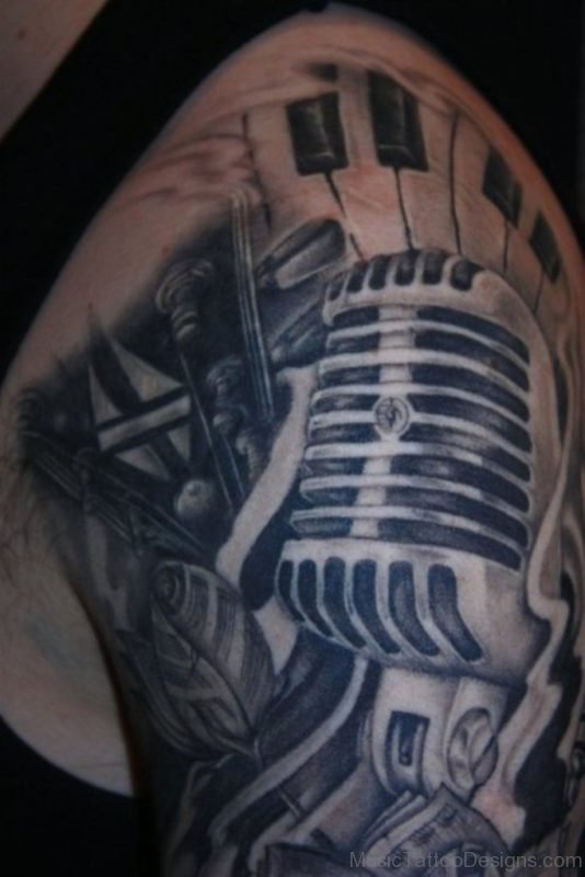 Mic And Guitar Tattoo On Shoulder