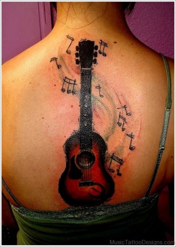 Music Notes Guitar Tattoo On Girl Back