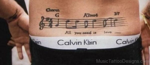 Music Notes Tattoo On Lower Back