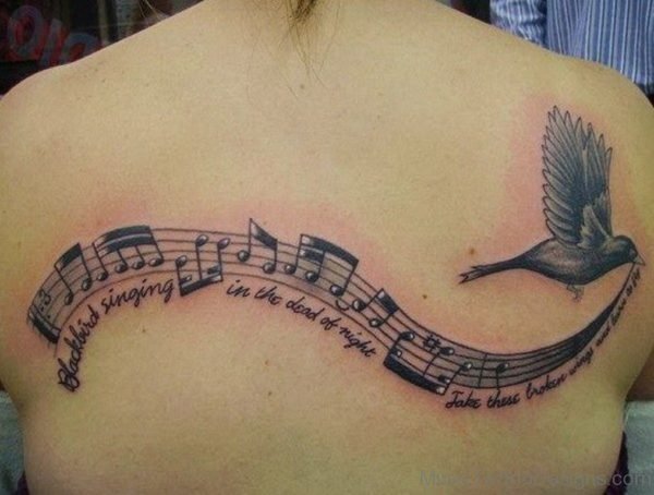Music Notes and Lyrics with a Bird is Flying Tattoo On Back