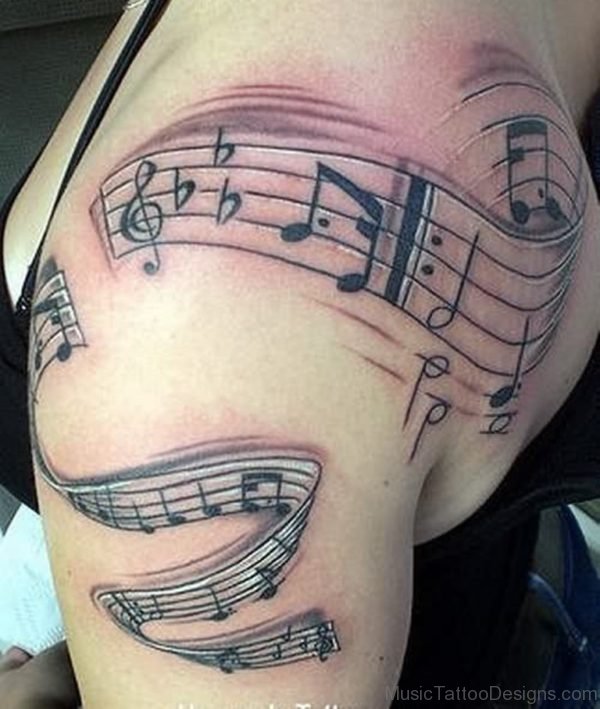 Music Tattoo On Bicep And Back
