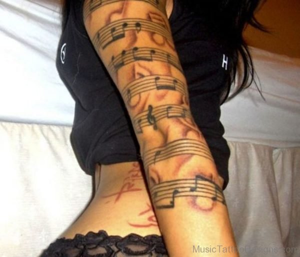 Music Tattoo On Girl Arm