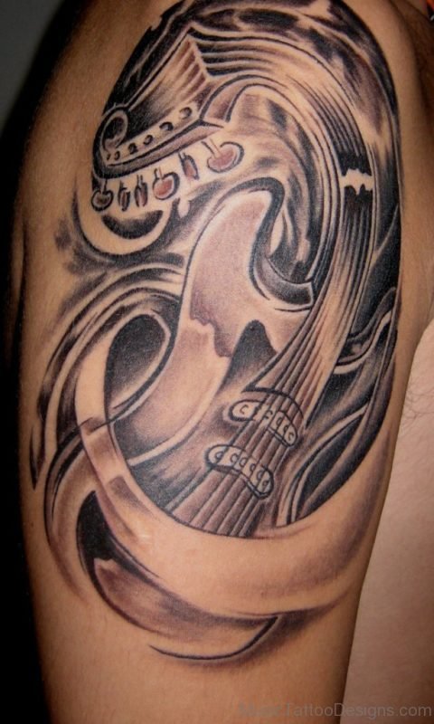 Nice Curved Guitar Tattoo On Shoulder