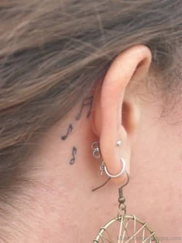Perfect Music Notes Tattoo Design For Women On Behind Ear