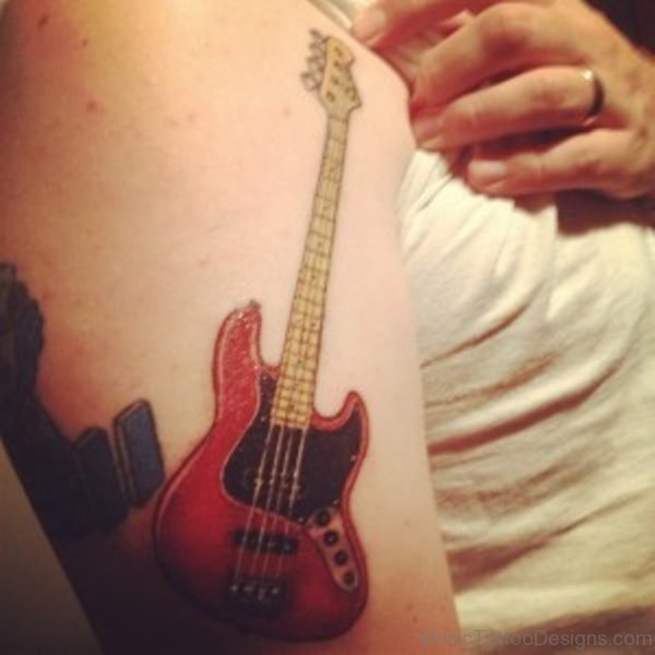 Red Colored Guitar Tattoo On Shoulder