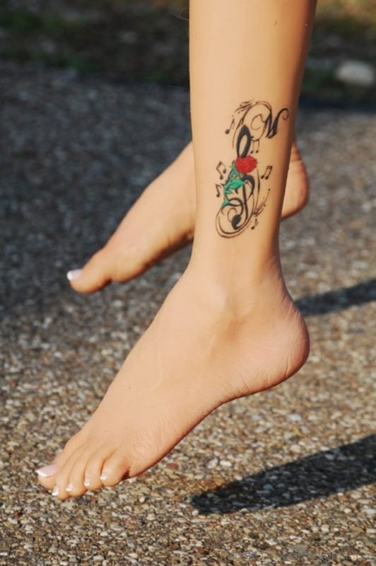 Red Rose And Music Tattoo On Ankle