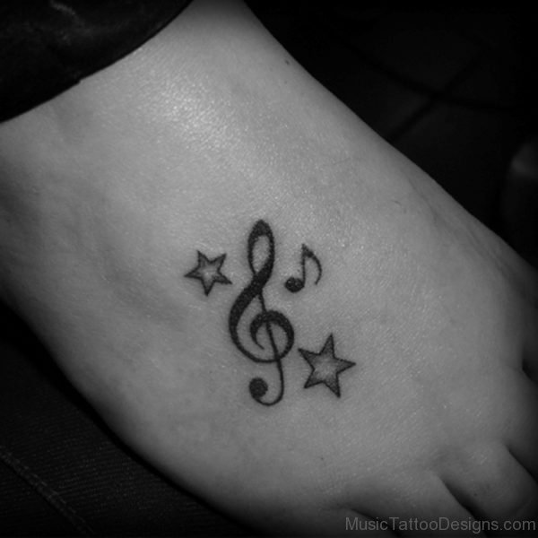 Star And Music Tattoo On Foot