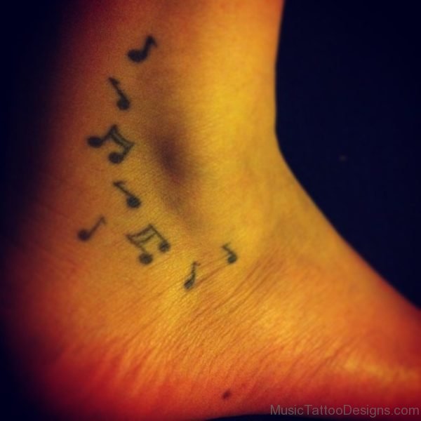 Tiny Music Notes Tattoo