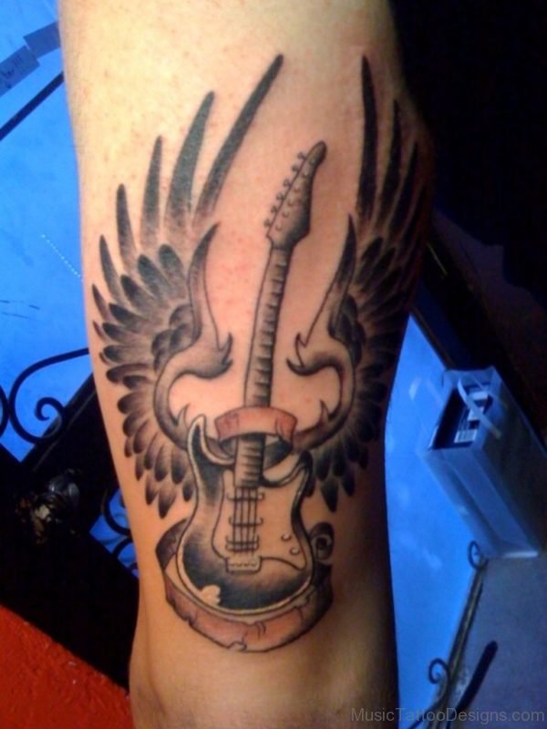 Winged Guitar Tattoo On Arm