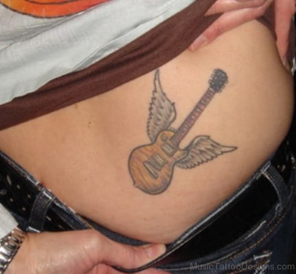 Winged Guitar Tattoo On Girl Lowerback