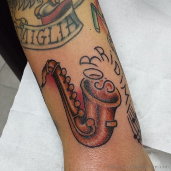 Awesome Saxophone Tattoo On Arm Image