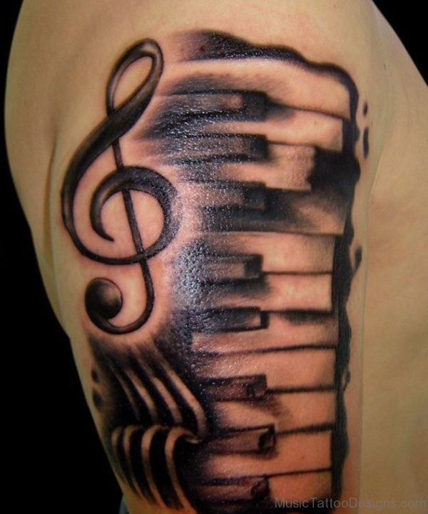 Black Ink Music Keyboard With Violin Key Tattoo On Shoulder