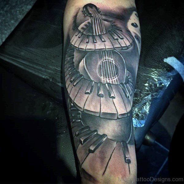 Black Spiral Piano Keys And Guitar Tattoo On Arm