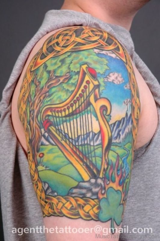 Colored Harp Tattoo On Half Sleeve