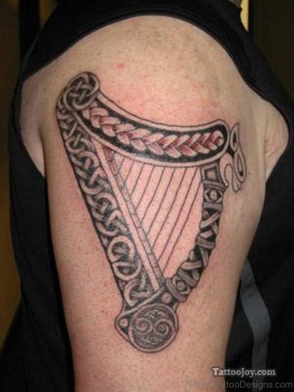 Excellent Harp Tattoo On Shoulder