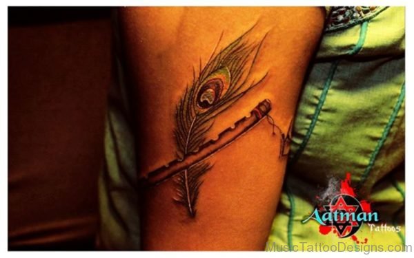 Feather With Flute Tattoo