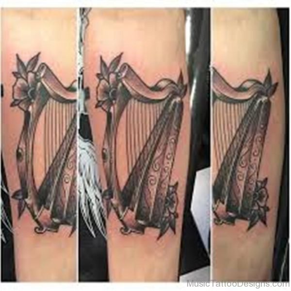 Grey Flower And Harp Tattoo