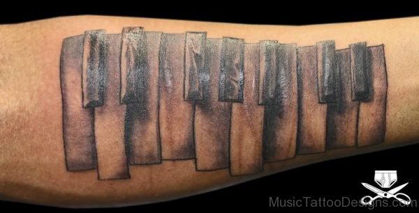 Grey Ink Piano Keys Tattoo On Forearm