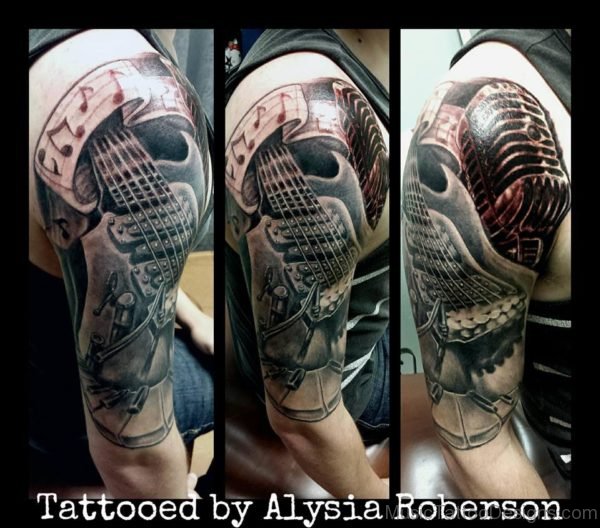 Guitar With Microphone And Piano Keys Tattoo