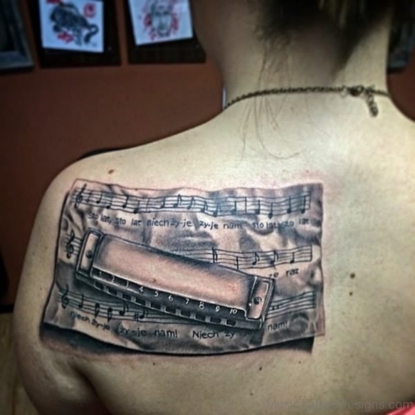 Harmonica Tattoo On Back