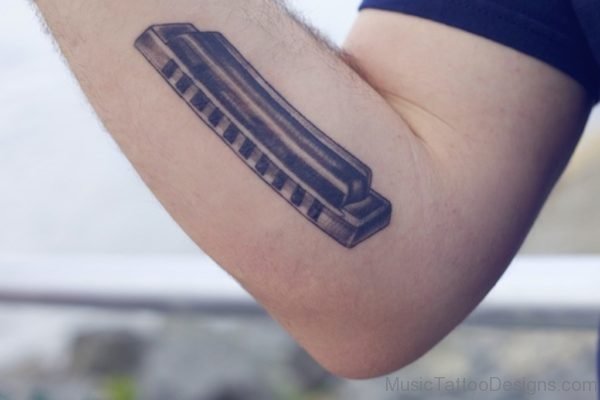 Harmonica Tattoo On arm