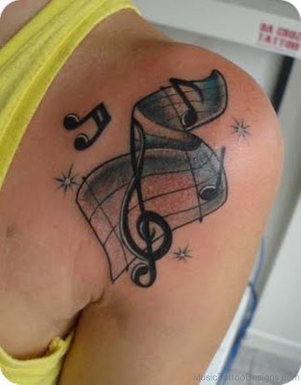 Impressive Music Tattoos On Front Shoulder