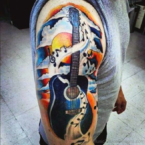 Man With Colorful Guitar Tattoo On Shoulder