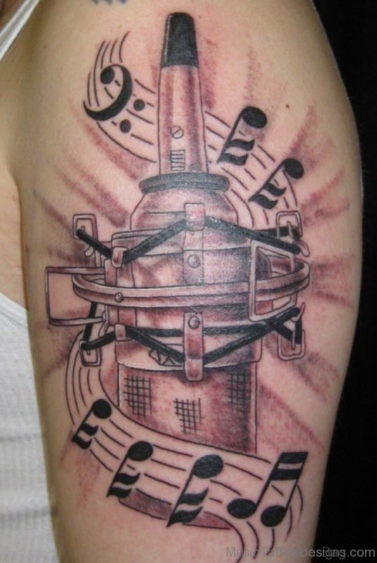 Massive Music Tattoo On Shoulder