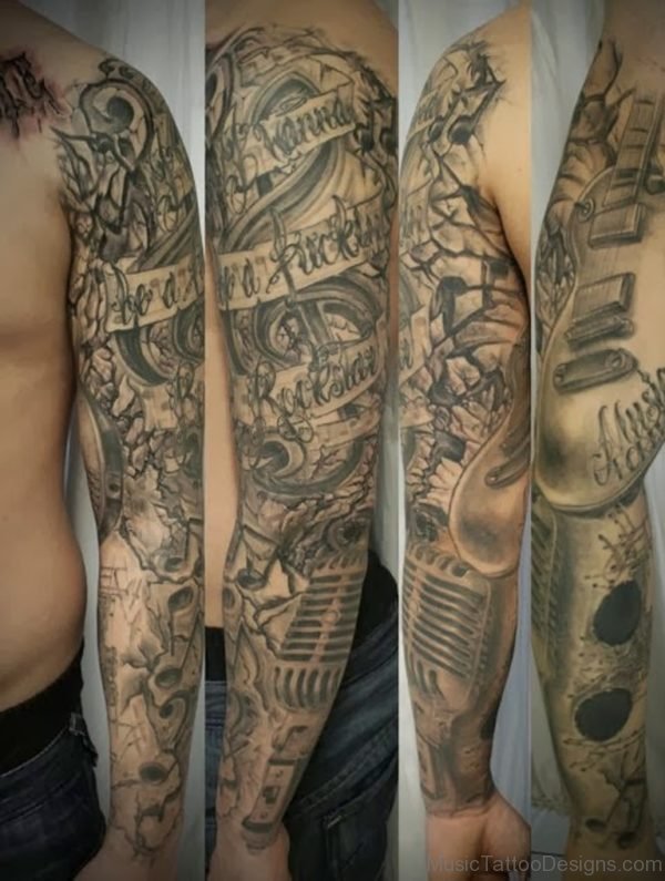 Microphone With Music Notes Tattoo On Full Arm