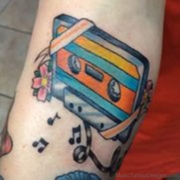 Music Notes And Cassette Tattoo Design
