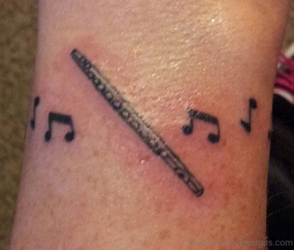 Music Notes And Flute Tattoo Design