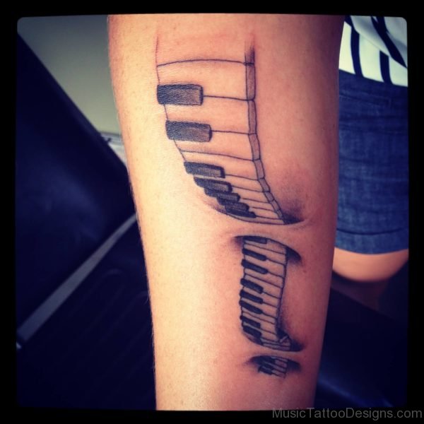 Nice Piano Ripped Skin Tattoo On Forearm