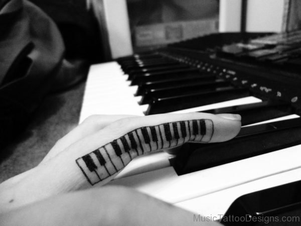 Nice Small Piano Keys Tattoo On Finger