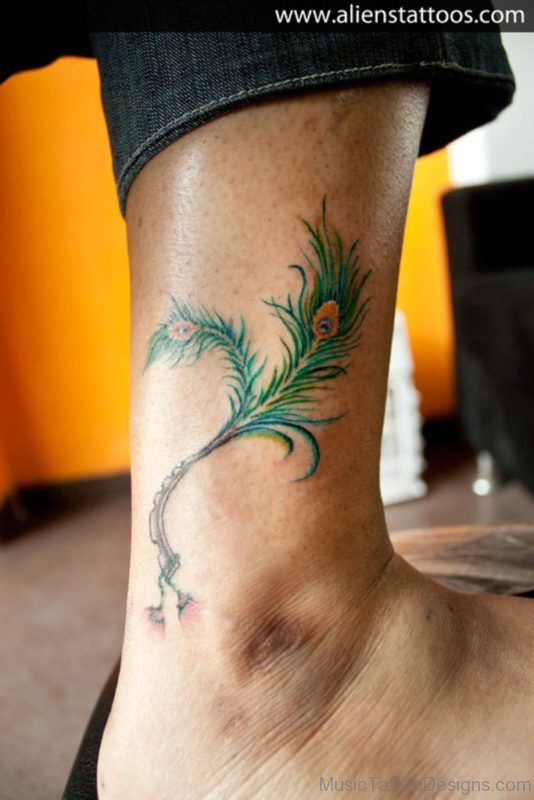 Peacock Feather with Flute Tattoo On Ankle
