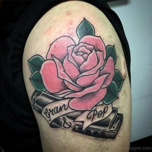 Pink Rose And Harmonica Tattoo