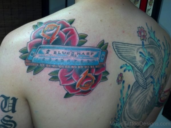 Rose And Harmonica Tattoo On Back