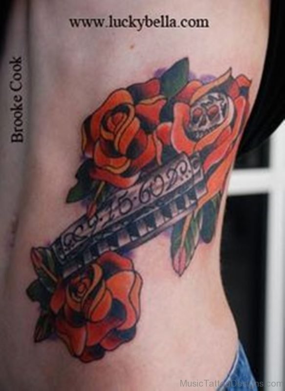 Rose And Harmonica Tattoo On Rib