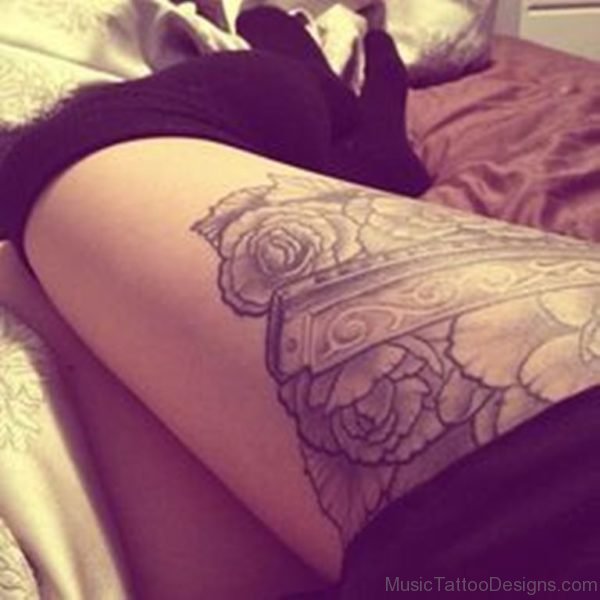 Rose And Harmonica Tattoo On Thigh
