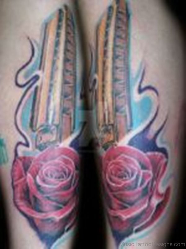 Rose Flower And Harmonica Tattoo